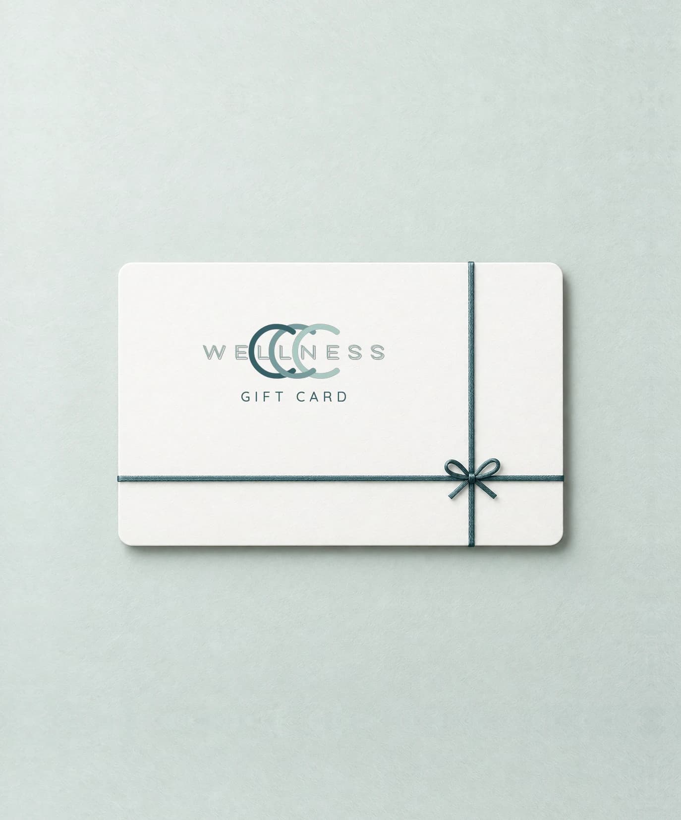 A CCC Wellness gift card tied with a green ribbon
